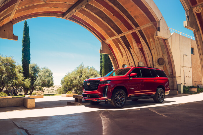 Drivers side view of the 2023 Cadillac Escalade-V under the arch at Arcosanti in Arizona.